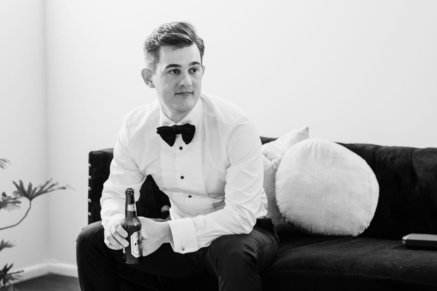 Elegant black and white portrait of wedding party members in formal attire.