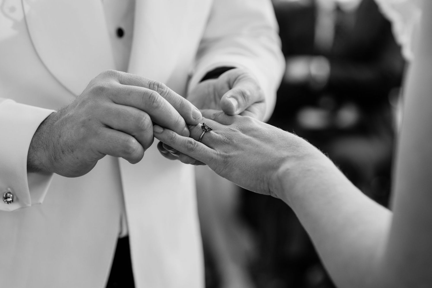 Black and white photo of wedding ring exchange between couple.The refinery wedding venue. Brisbane.