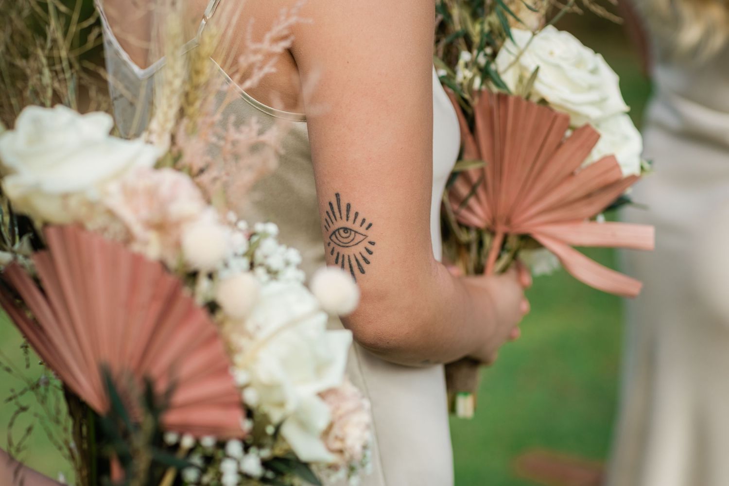Blush and white floral bouquet with dried palm fronds at outdoor wedding.Miami Burleigh heads beach wedding