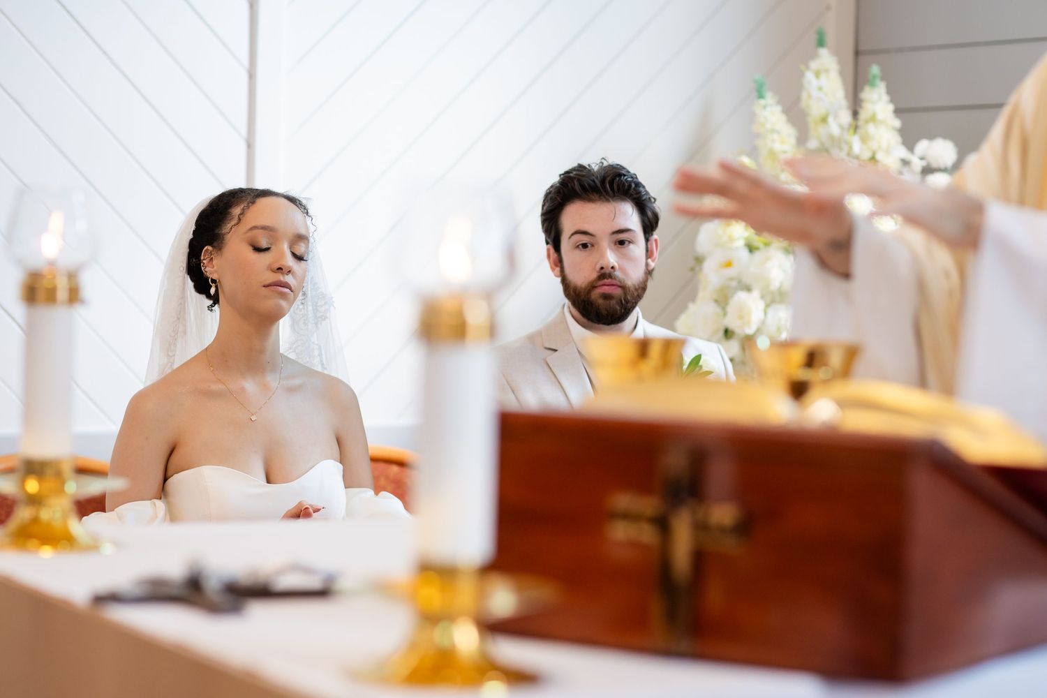 Elegant wedding celebration inside a modern white chapel with natural light streaming through windows.The barrow restaurant mount Nathan wed