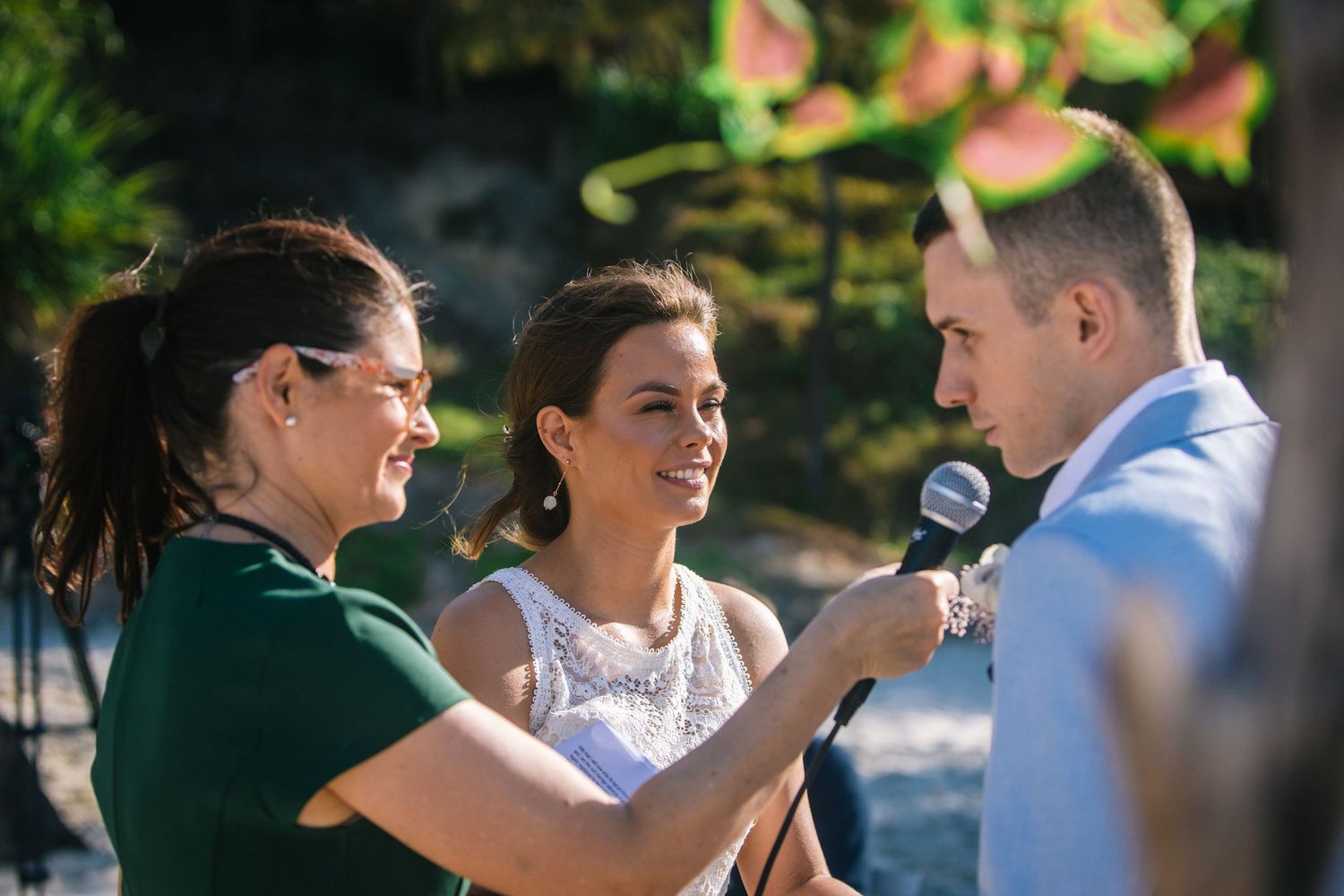 Intimate outdoor wedding ceremony with guests sharing joyful moments.