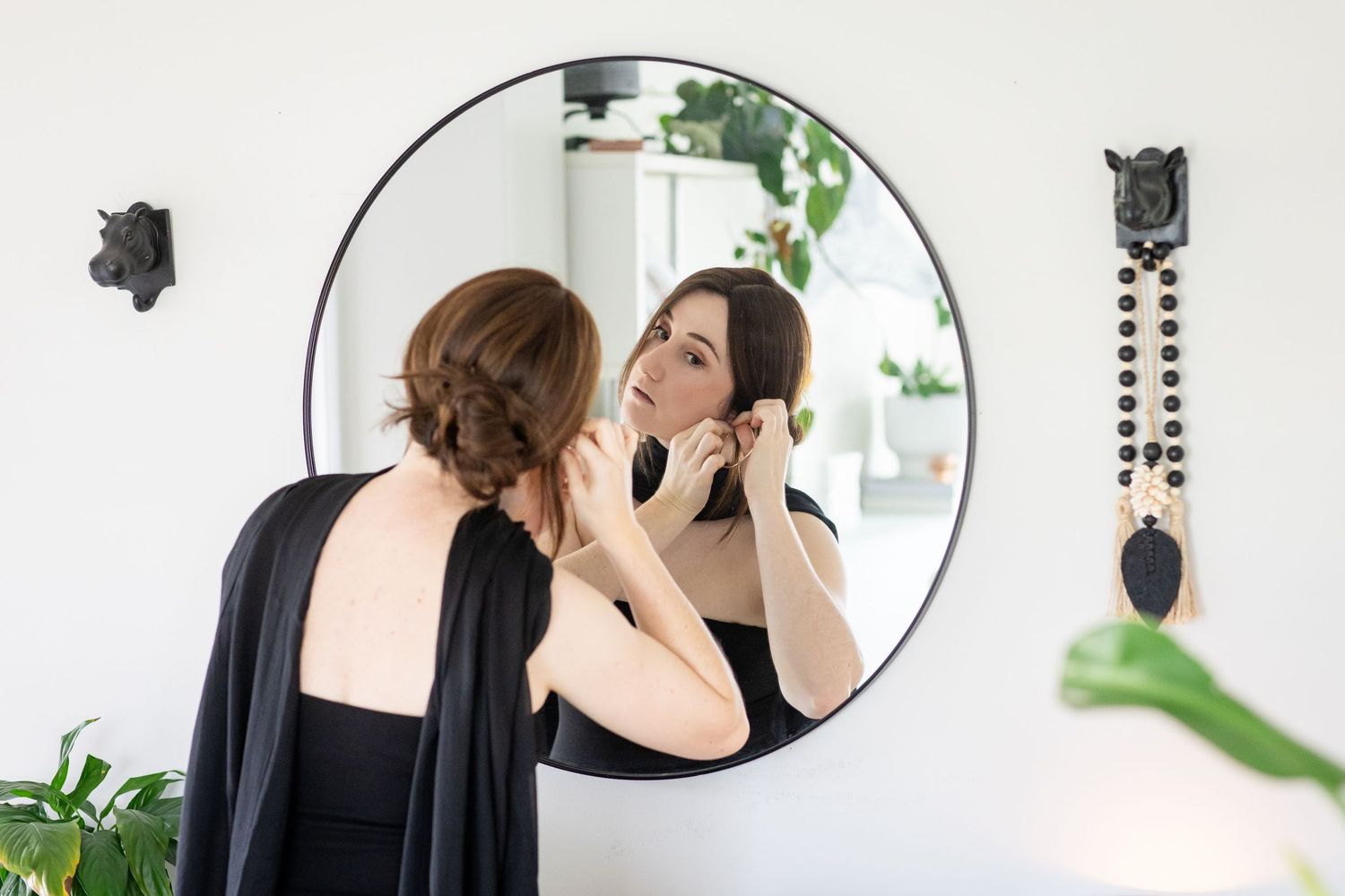 Getting ready scene with mirrors and indoor plants in a bright white room.Gold Coast hinterland wedding photographer
