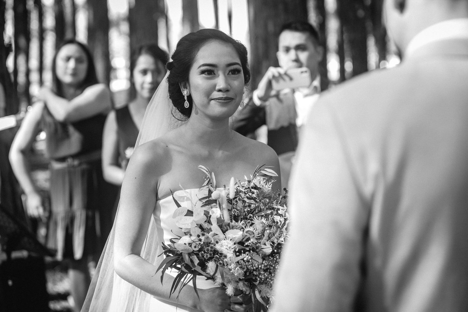 Wedding ceremony moment captured in a forest with beautiful natural lighting.pizzey park wedding Gold Coast