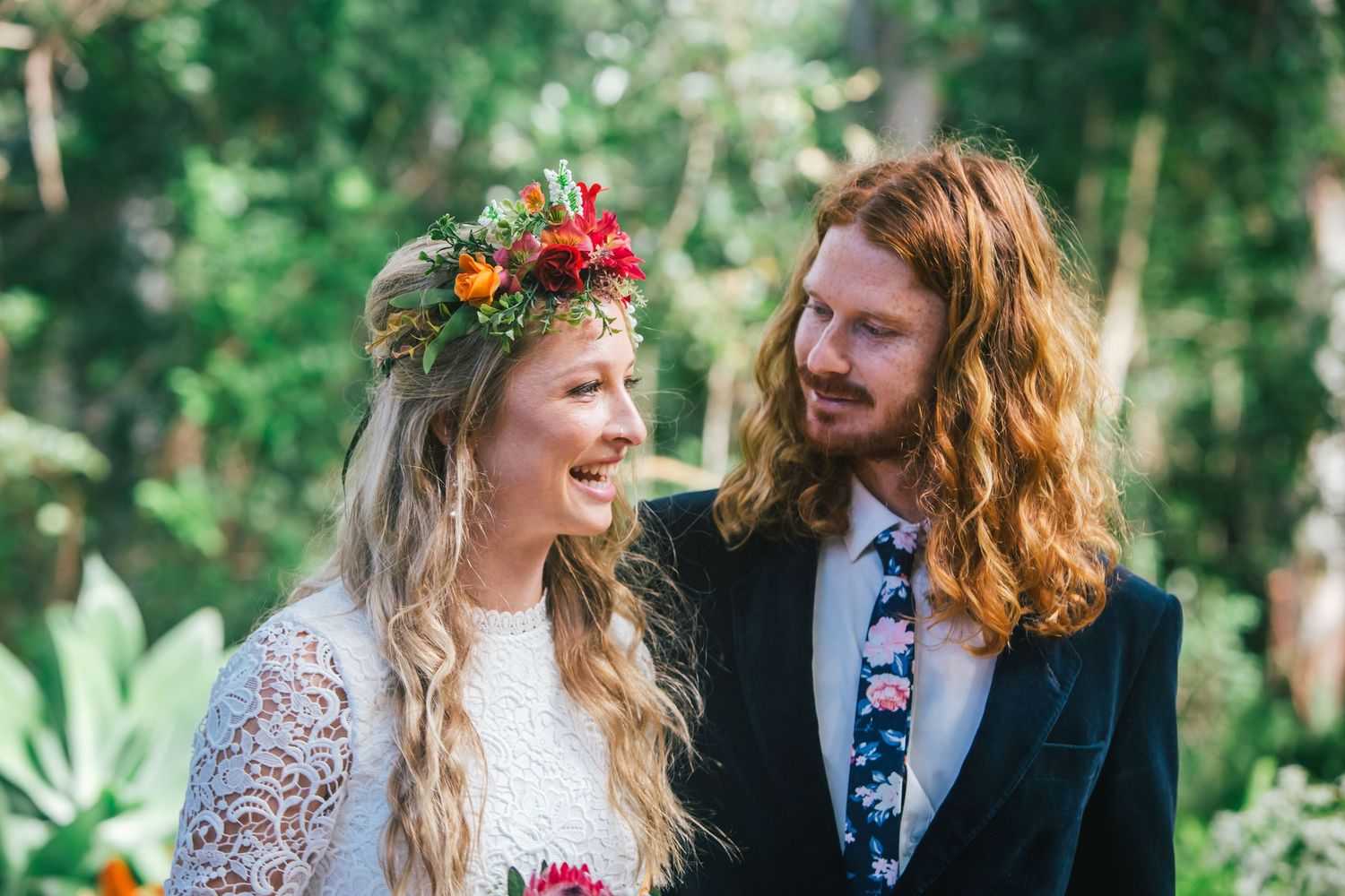 Outdoor celebration with musicians and guests in a garden setting.