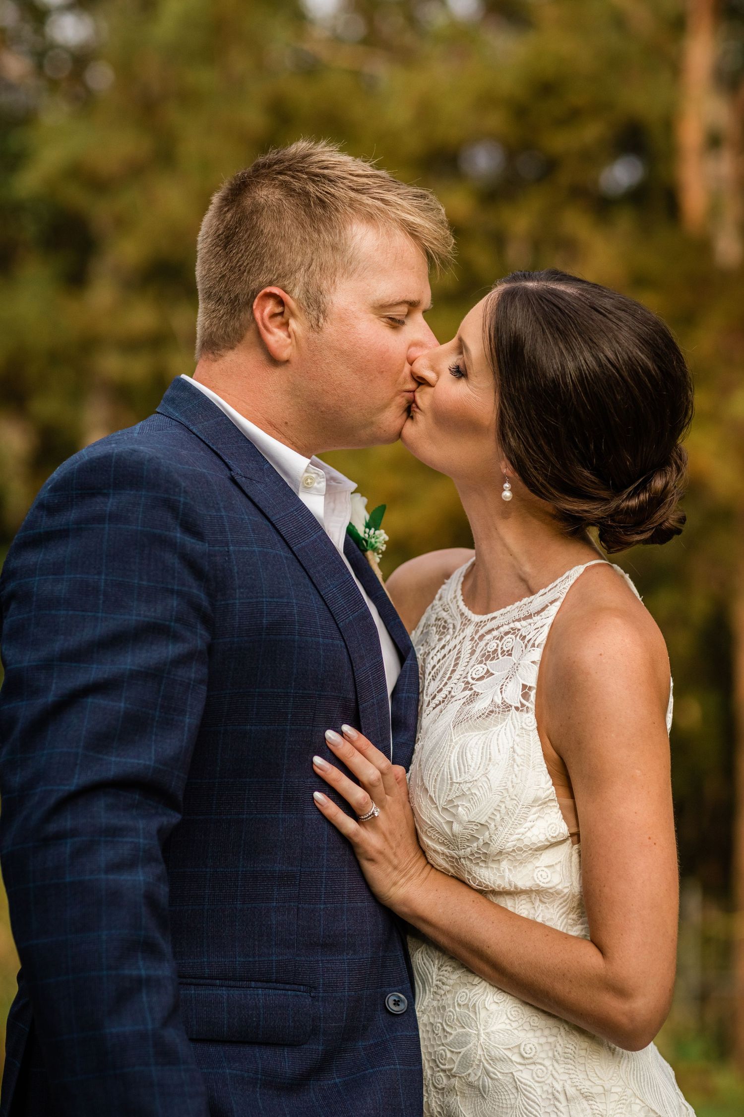 Intimate wedding portrait captured during golden hour with natural forest backdrop.candid wedding photography Gold Coast