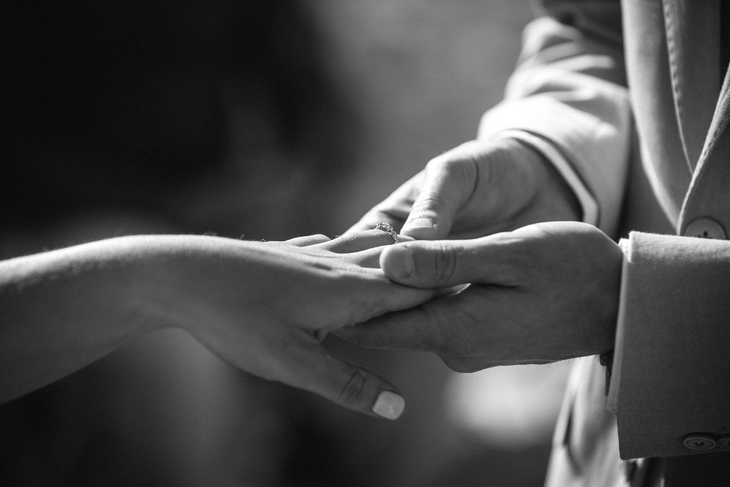 Black and white detail shots of hands during wedding ceremony exchanges.Gold Coast beach wedding photography. Froggies beach