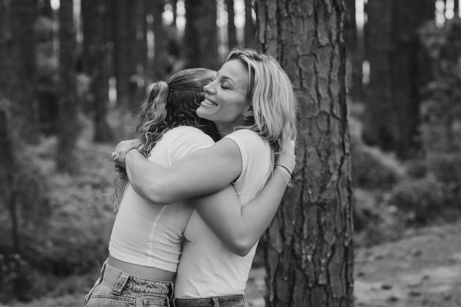 Emotional candid moments captured in black and white against forest backdrop. Pizzey park family photos. Gold Coast