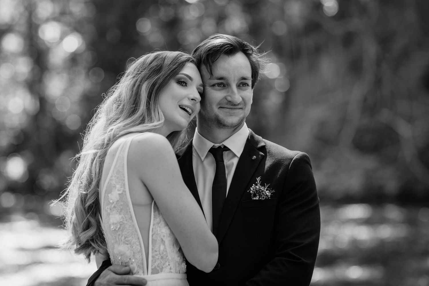 Intimate black and white wedding portraits captured in natural outdoor lighting.