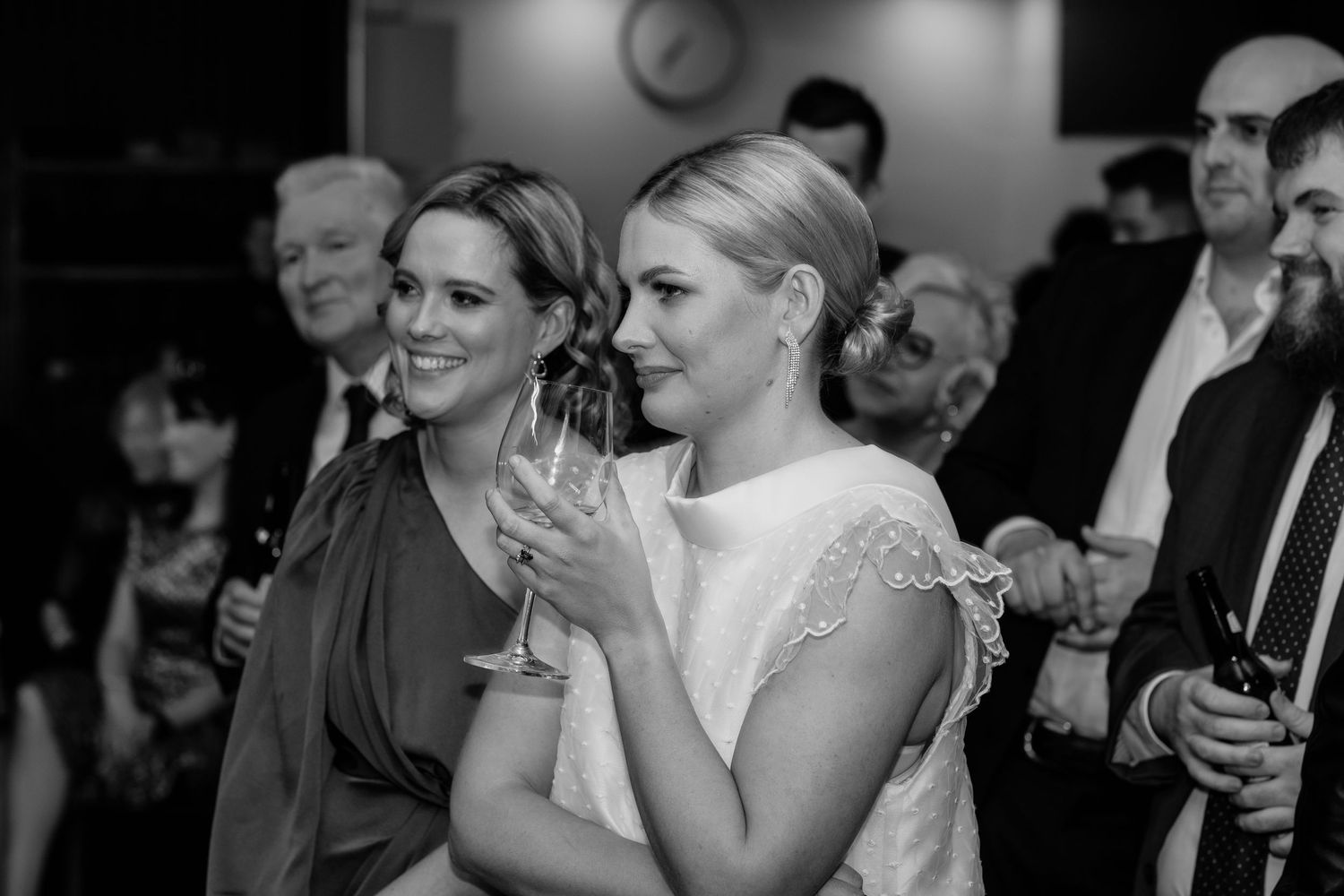 Emotional reactions captured during wedding reception speeches and toasts.