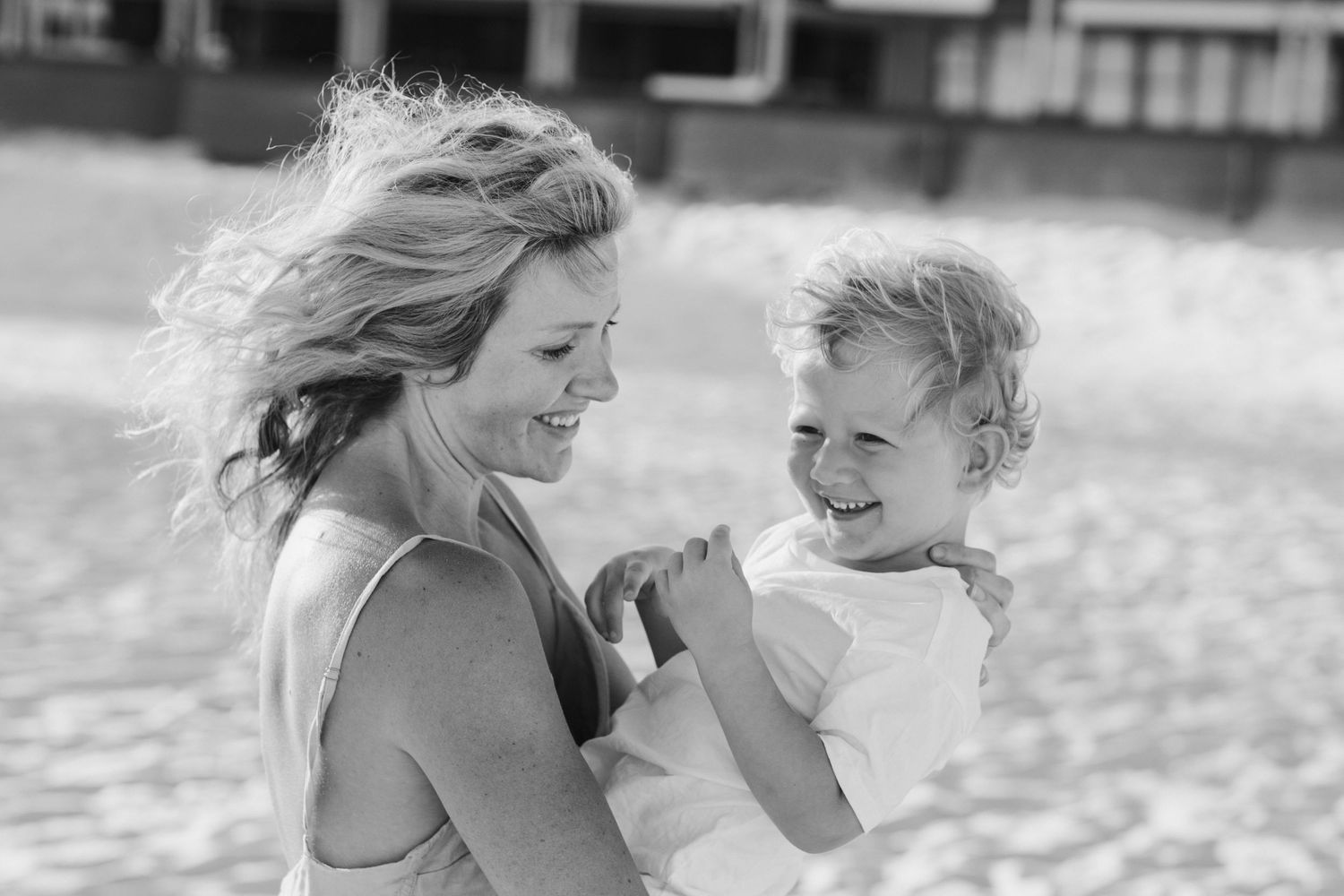 Joyful candid moments shared between loved ones at the beach.Gold Coast candid family photographer.