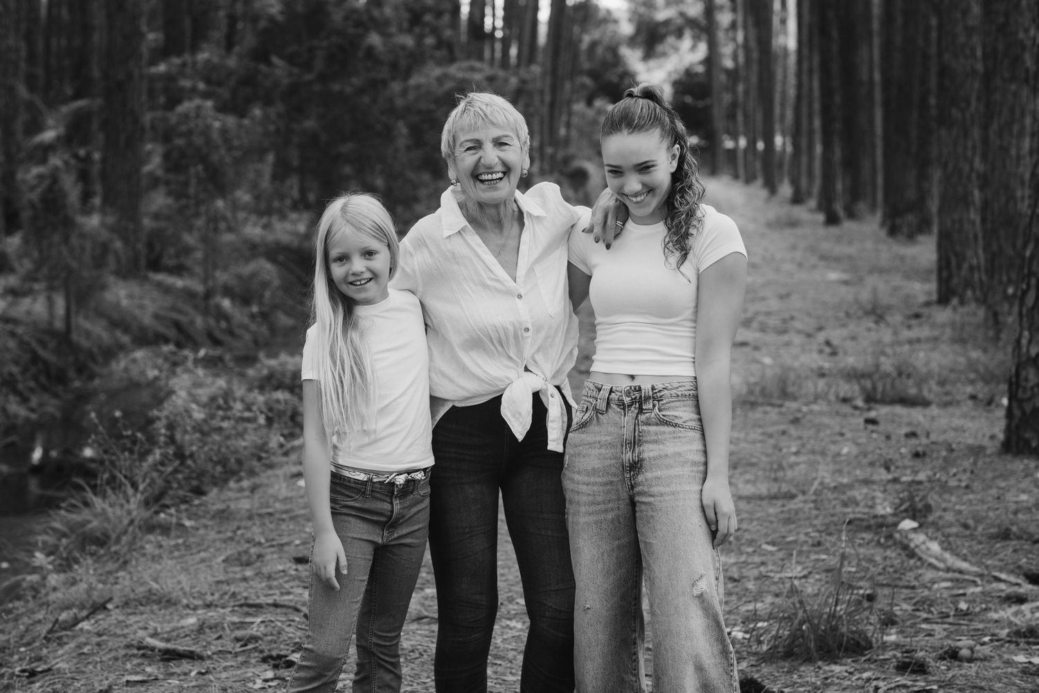 Casual outdoor photography session among tall pine trees in natural lighting.Pizzey park family photos. Gold Coast