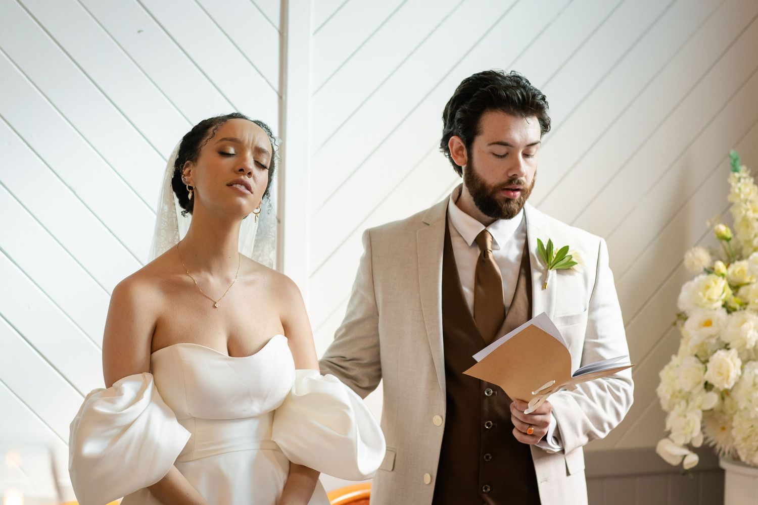 Candid wedding moments captured in sequence inside a bright modern chapel.The barrow restaurant mount Nathan wedding