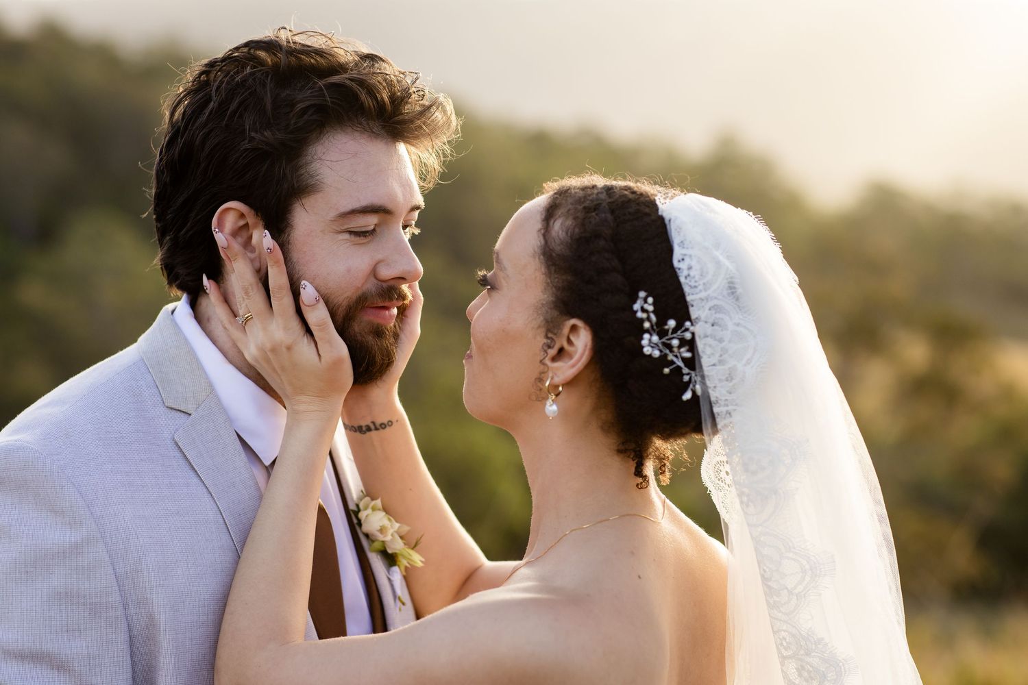 Intimate wedding portrait captured in warm golden light against natural outdoor setting.The barrow restaurant mount Nathan wedding