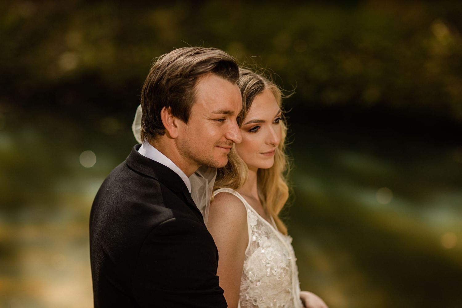 Couple shares tender moments during their outdoor wedding photoshoot at golden hour.Currumbin Valley wedding photography Gold Coast