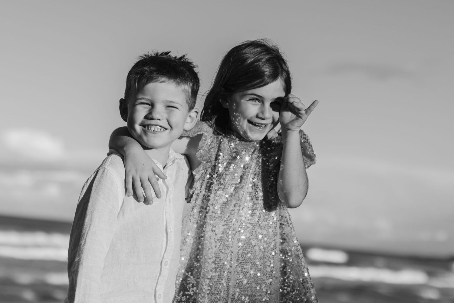 Monochrome beach photography session with dramatic coastal lighting.Family photography cabarita New South Wales Cabarita headland