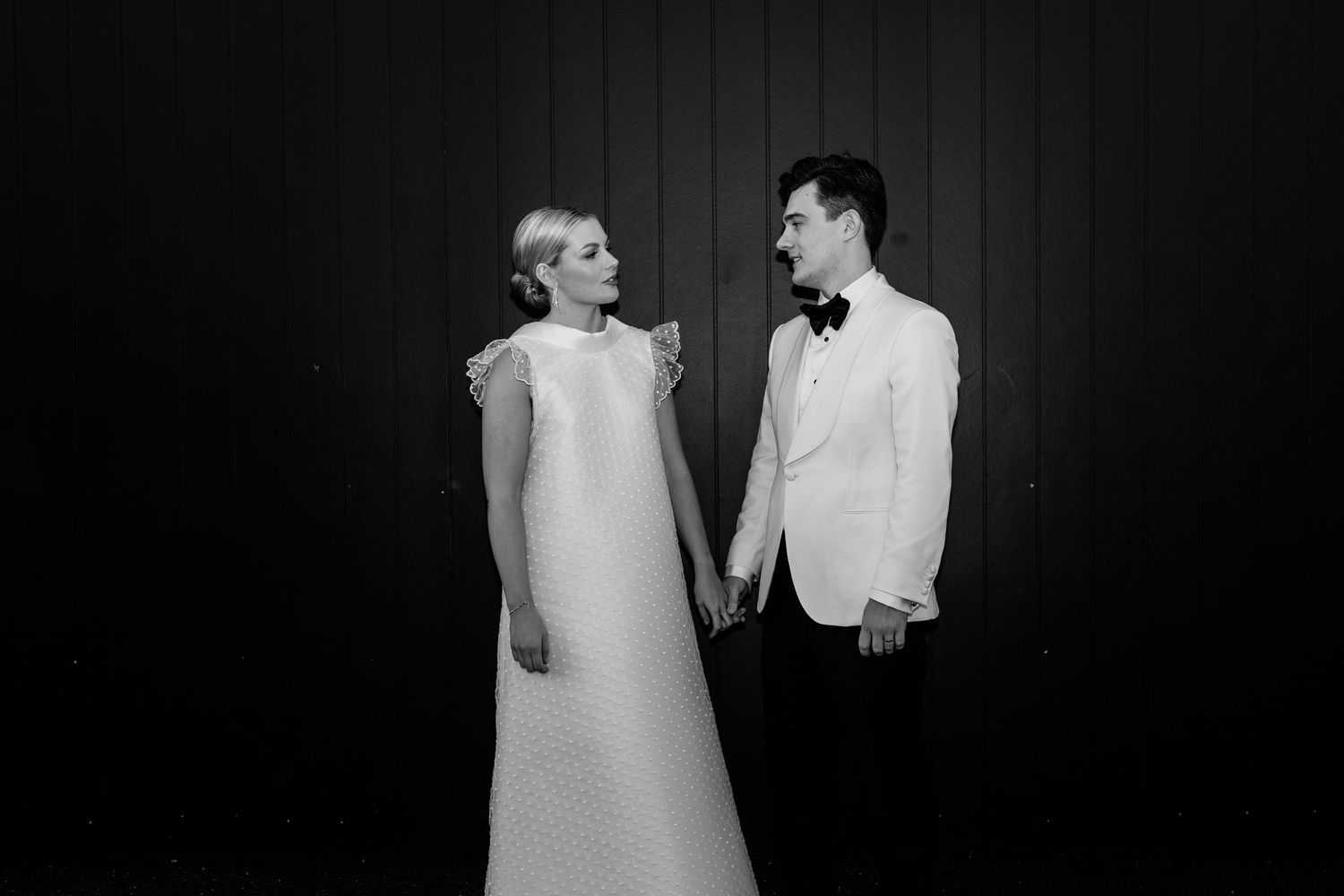 Black and white wedding photography against dark wooden wall backdrop.The refinery wedding venue. Brisbane.