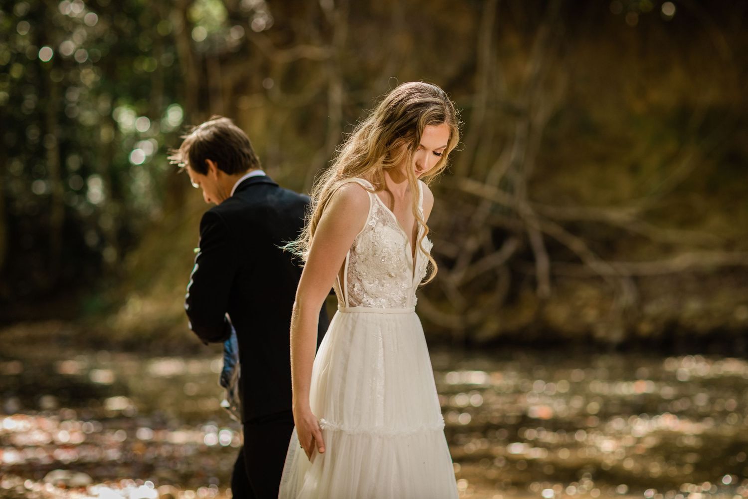 A romantic wedding photoshoot in a sun-dappled forest setting.Gold Coast beach wedding photographyGold Coast beach wedding photography