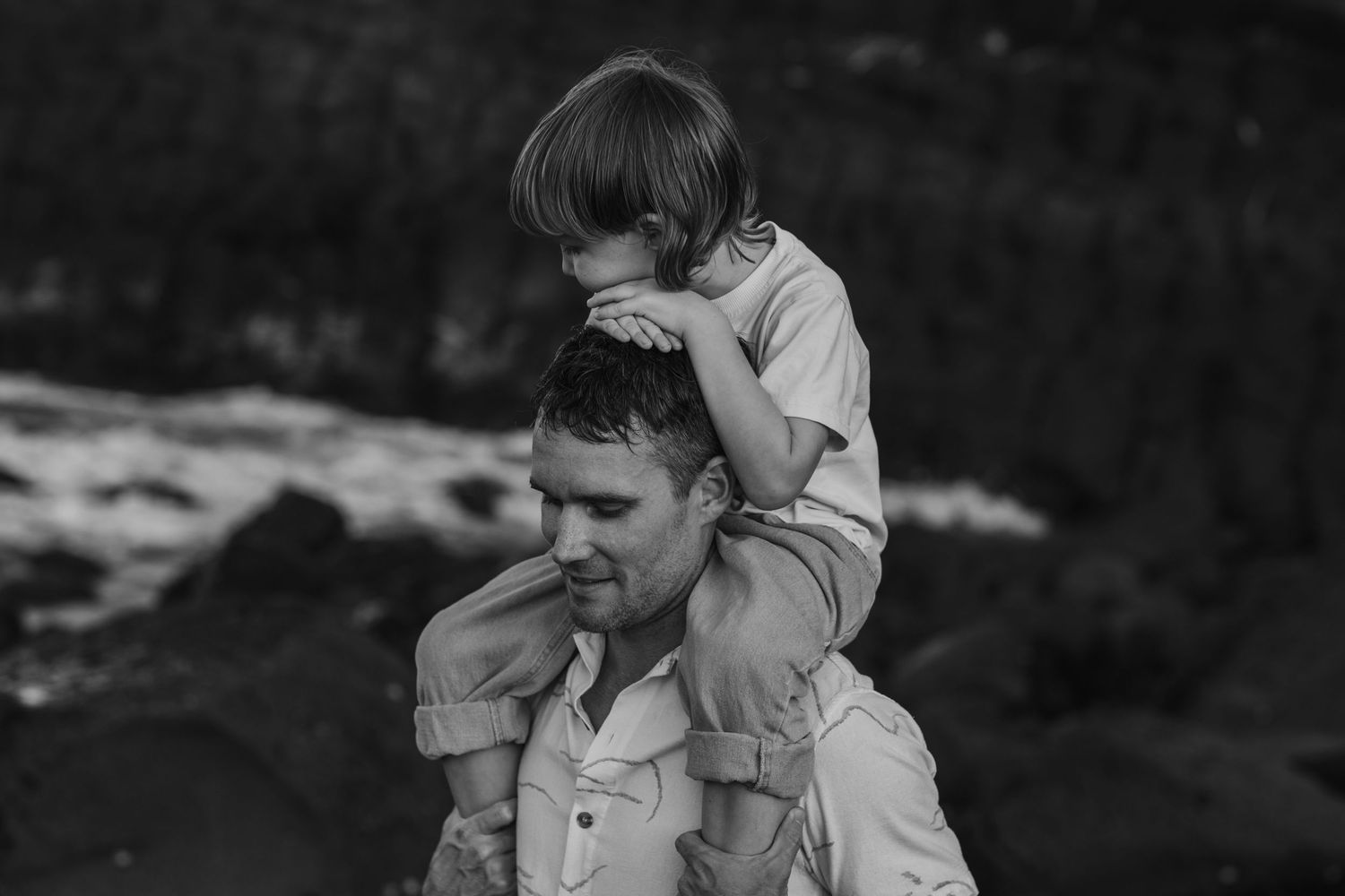 Black and white portrait capturing intimate dance movements in natural outdoor setting.Fingal head family photos -  New South Wales