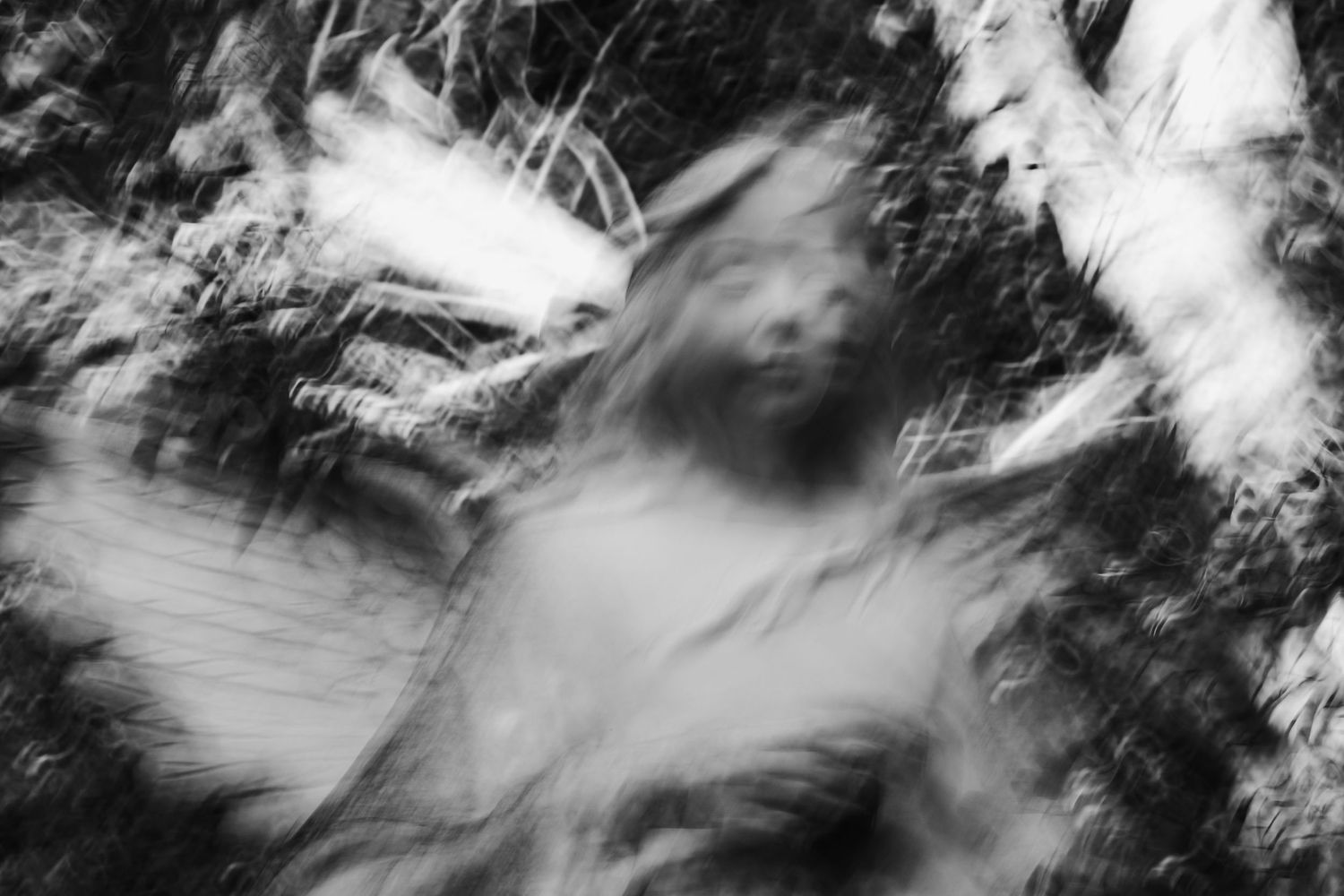 High contrast black and white abstract photographs with dynamic motion blur.