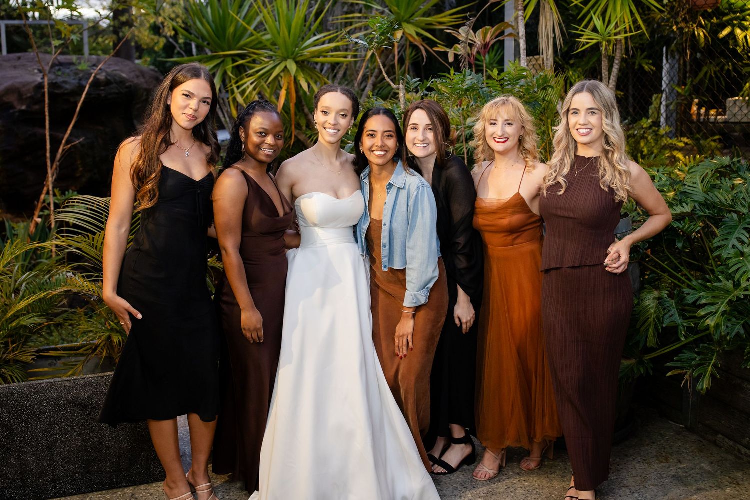 Outdoor wedding reception with guests gathered in a lush garden setting.Currumbin Valley wedding photography Gold Coast