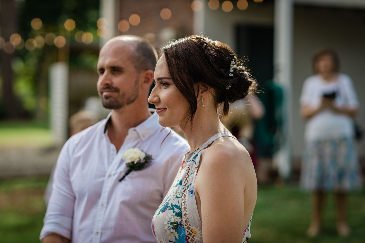 Intimate outdoor wedding ceremony with string lights and natural decor.Gold Coast beach wedding photography