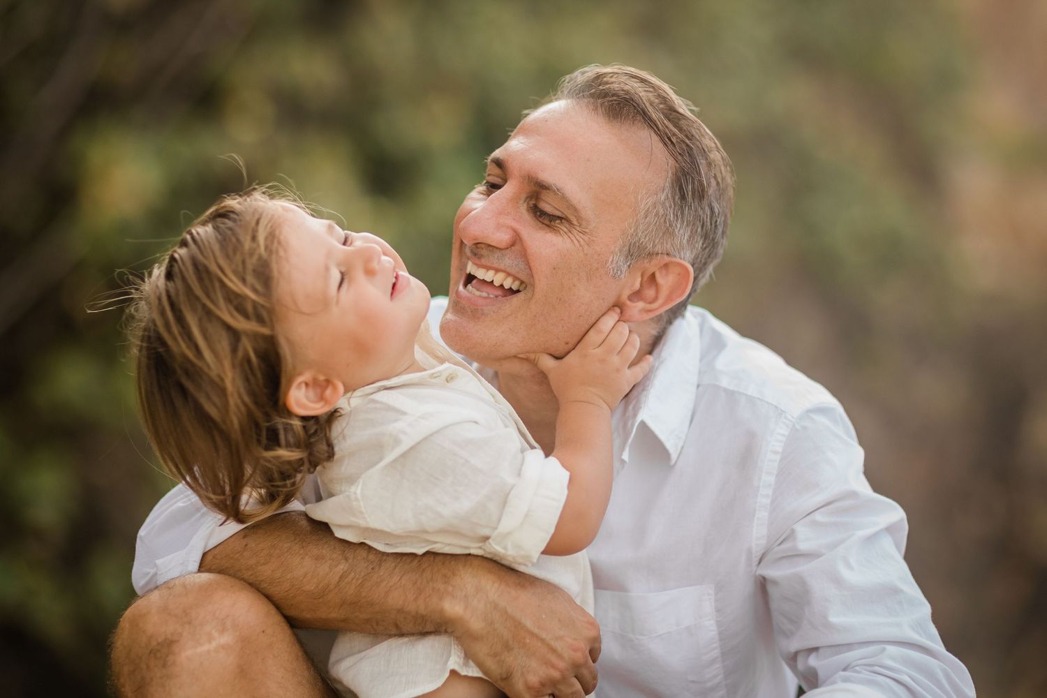 Candid family moments captured in a series of loving embraces at sunset.Gold Coast candid family photographer.