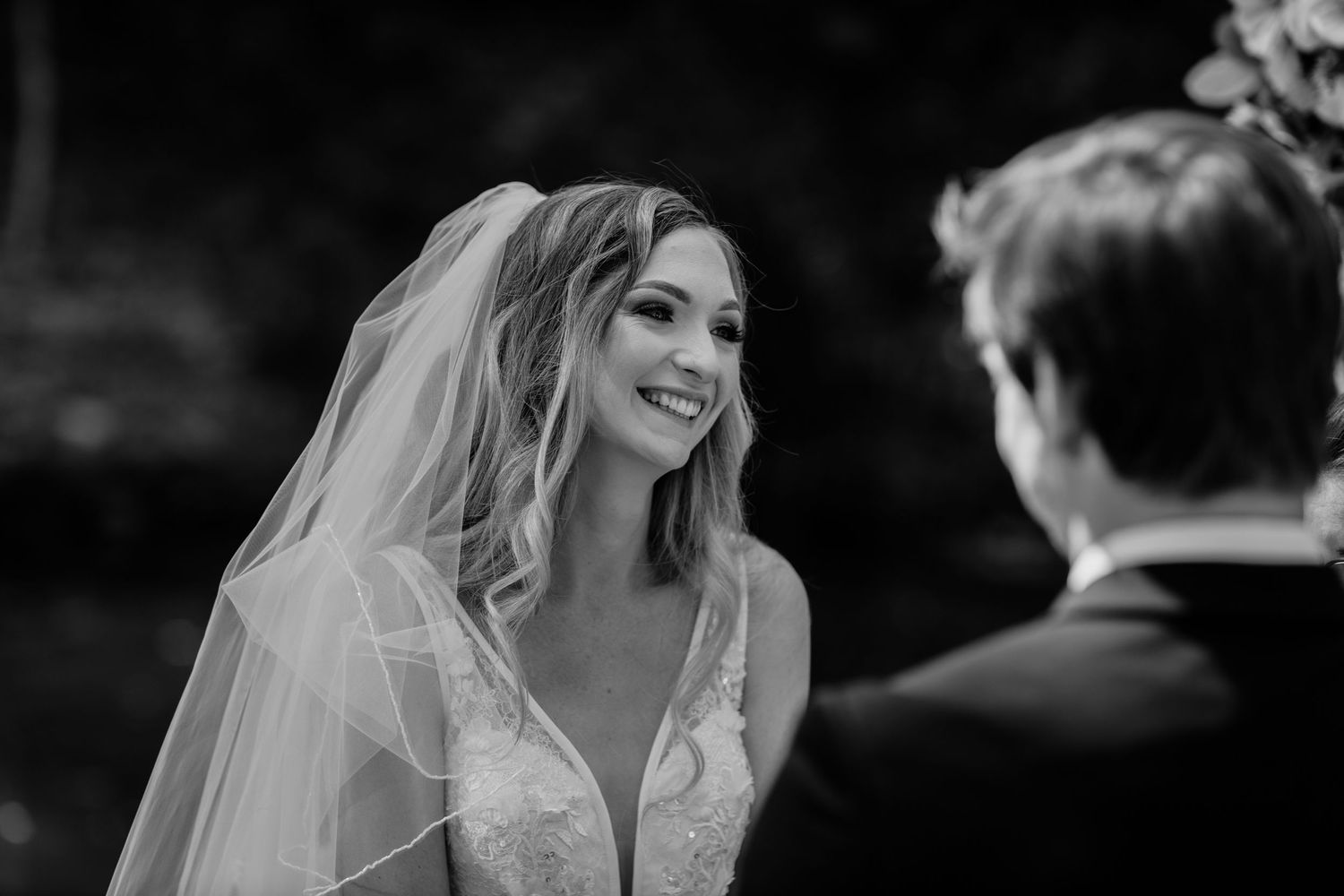 Black and white candid moments captured during an outdoor wedding ceremony.Currumbin Valley wedding photography Gold Coast