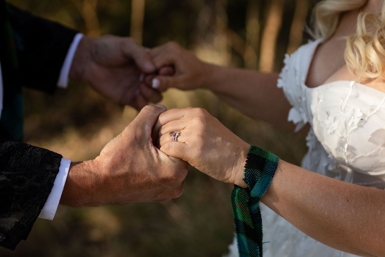 Close-up of wedding rings being exchanged during outdoor ceremony.Gold Coast wedding photographer