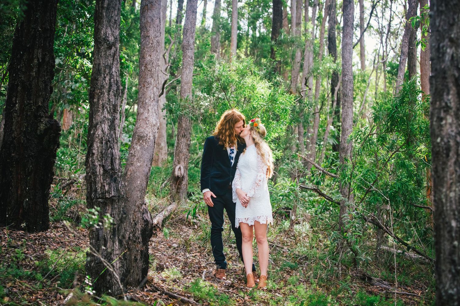 Wedding celebration in a serene forest setting with tall trees creating natural ambiance.DIY wedding Gold Coast elopement photographer Gold