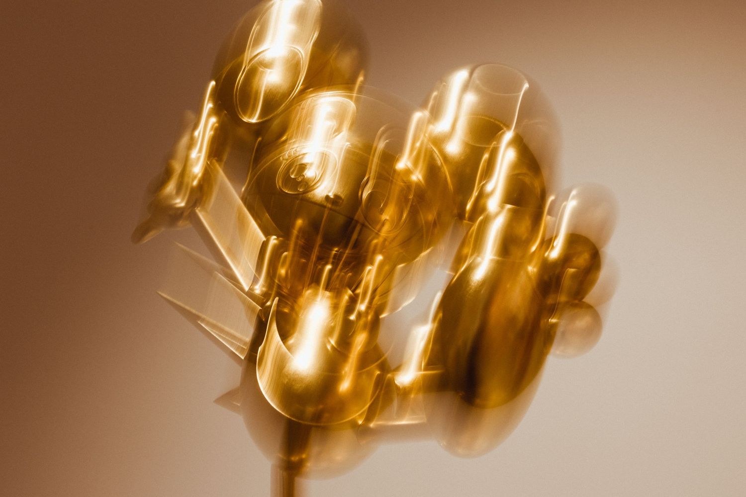 Close-up of golden chandelier lights creating bokeh effect.