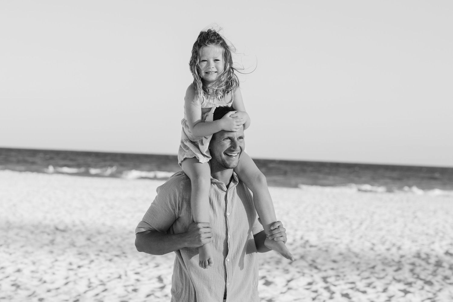 Candid beach photography session with natural lighting.Gold Coast candid family photographer.
