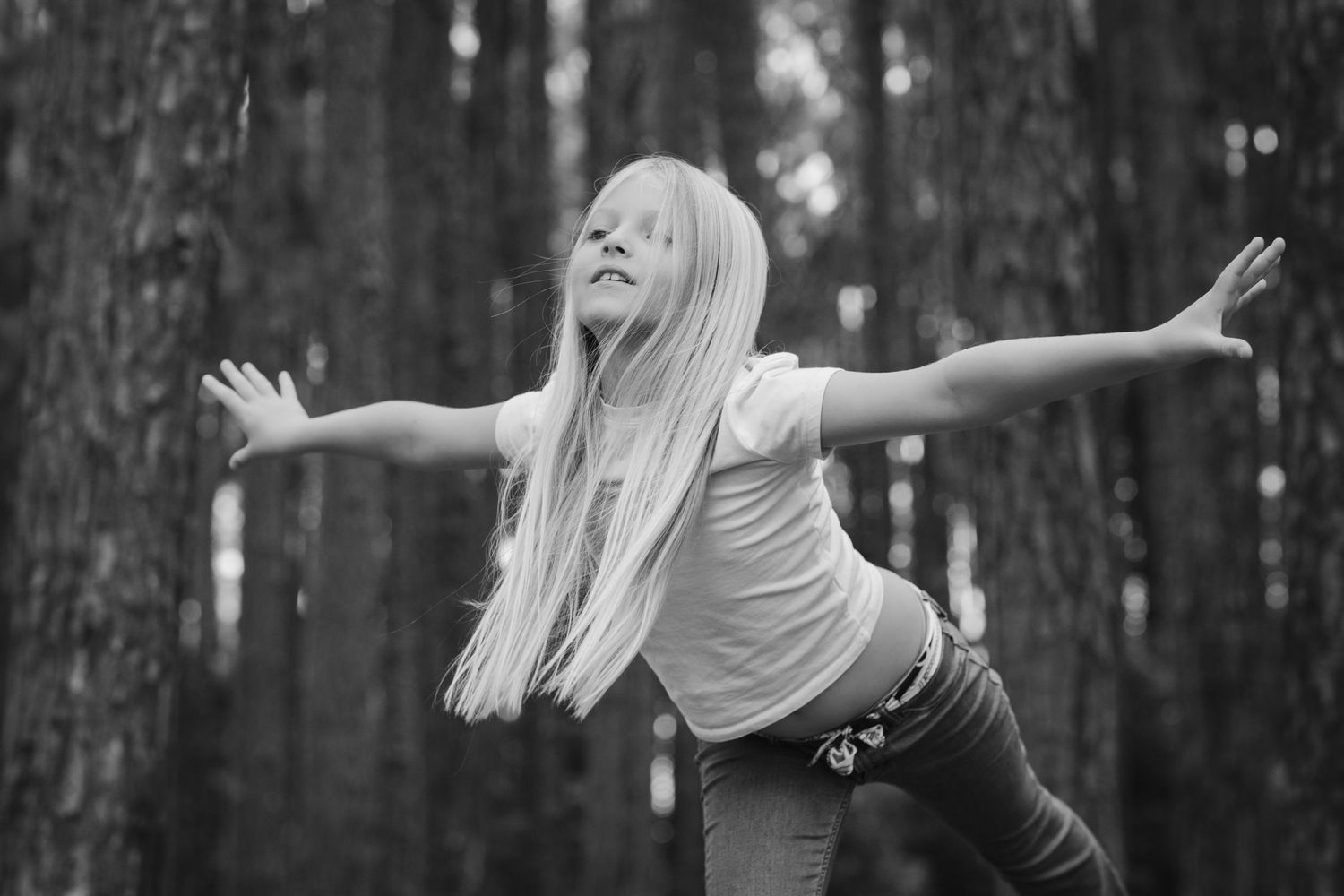 Playful poses and expressions photographed in a moody forest setting.Pizzey park family photos. Gold Coast