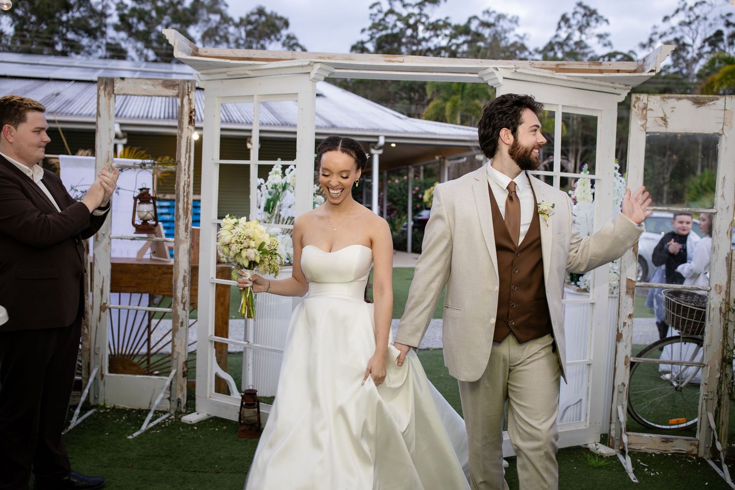 An outdoor wedding reception setup with white tents and elegant decor.The barrow restaurant mount Nathan wedding