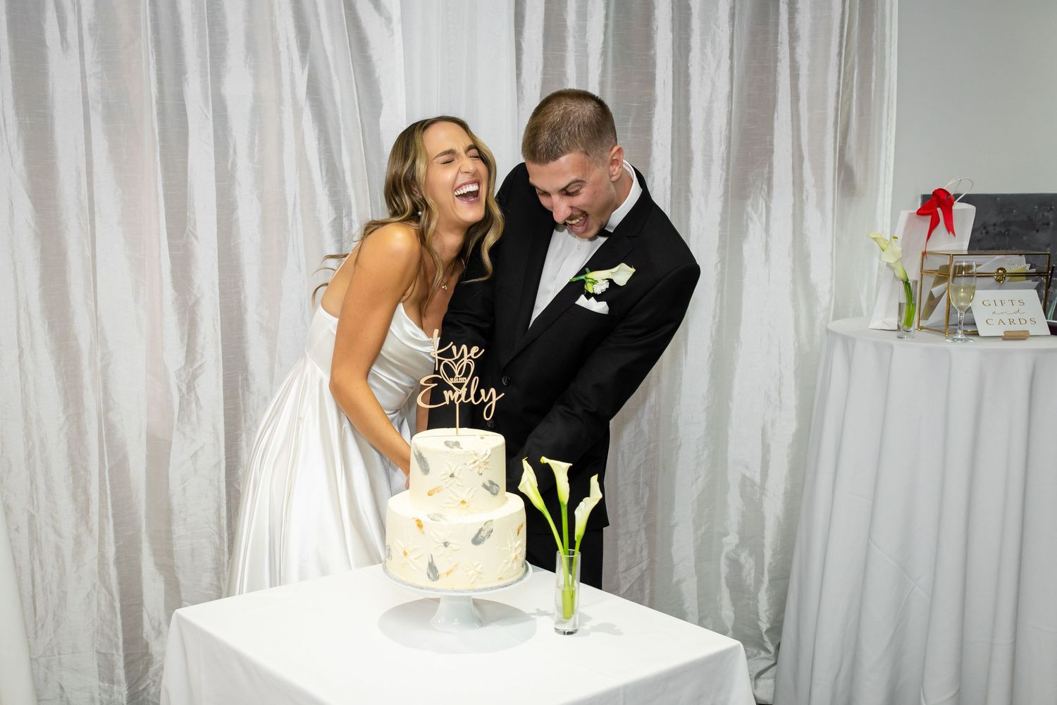 Elegant wedding reception setup with white drapes and floral decorations.beach wedding currumbin surf club wedding