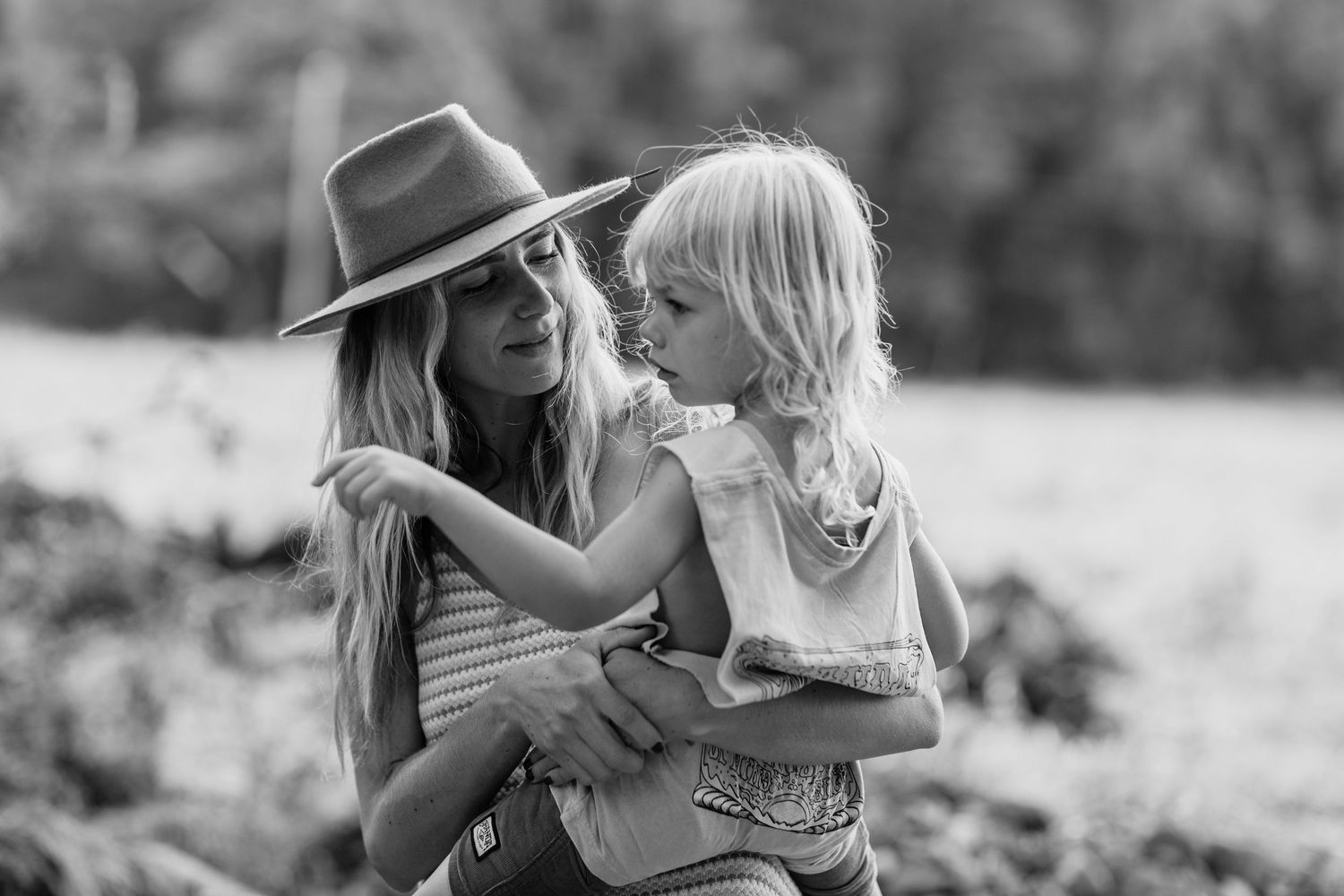 Black and white portrait of tender family moments in nature.Gold Coast family photographer Gold Coast candid family photographer.