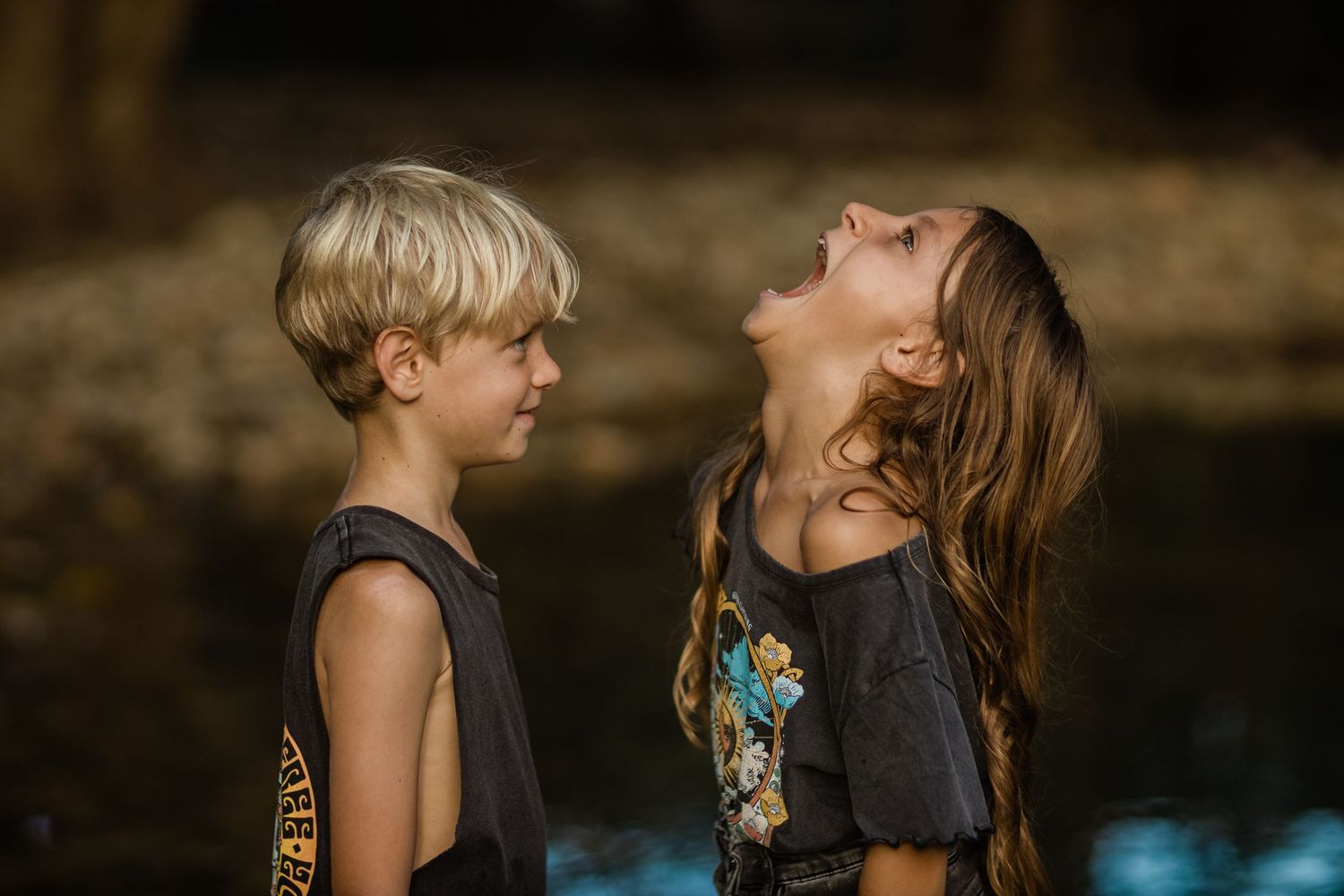 Children in casual summer attire enjoying a day by the water.Gold Coast candid family photographer.