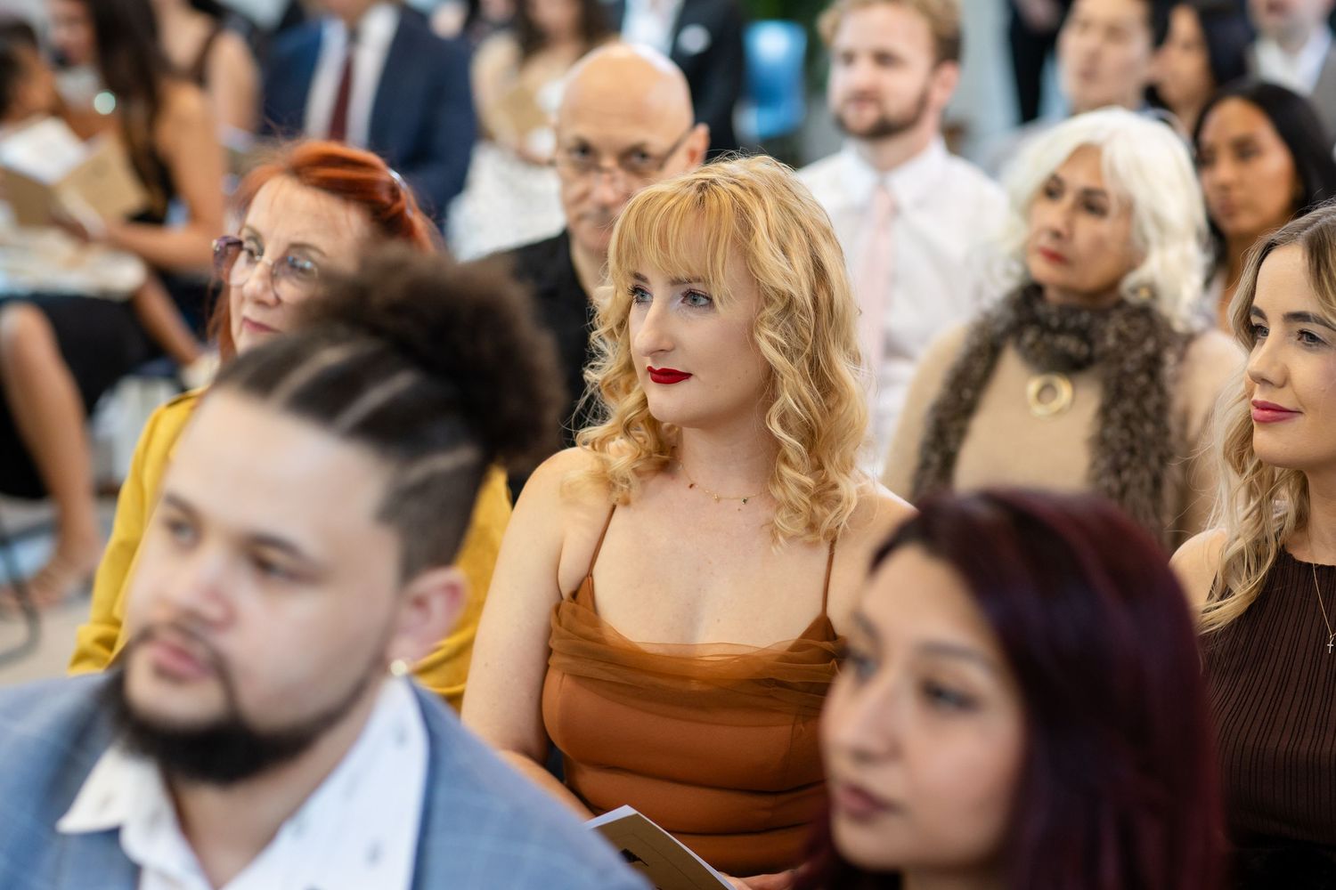 Wedding guests watch attentively during an indoor ceremony.Gold Coast hinterland wedding photographer