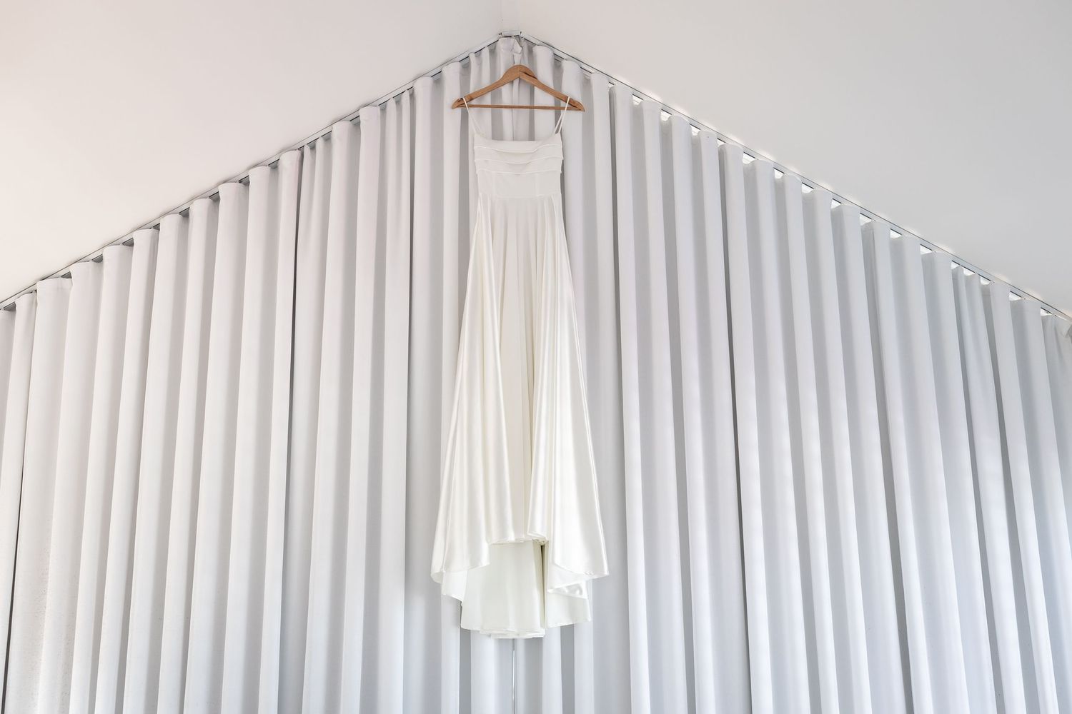 White window blinds create a bright and airy atmosphere in a modern room.