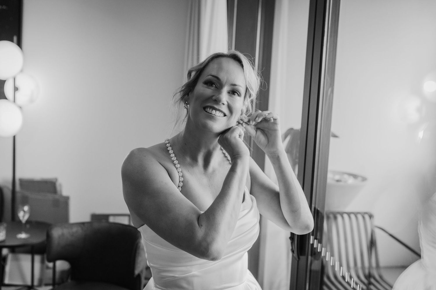 Black and white candid moments captured during wedding preparations.