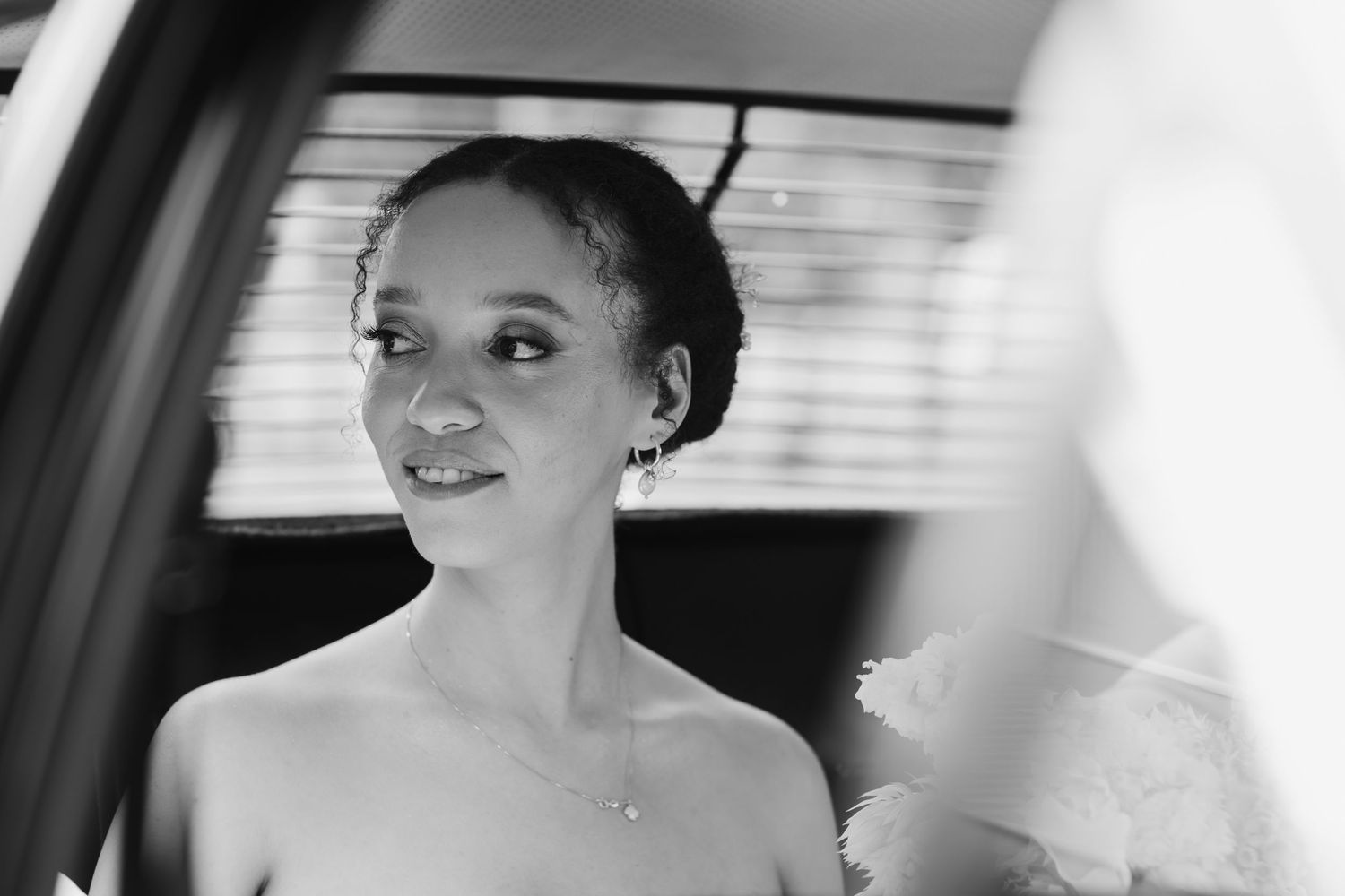Soft focus black and white candid wedding day portrait.