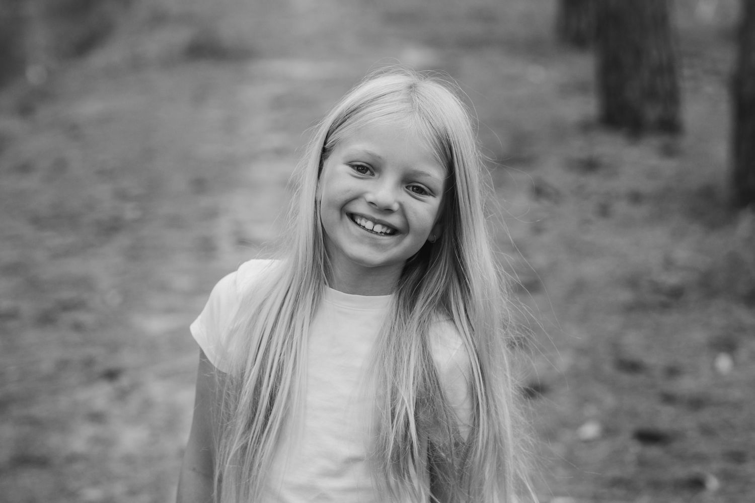 Black and white portrait series showing joyful expressions and natural emotion.Gold Coast candid family photographer.