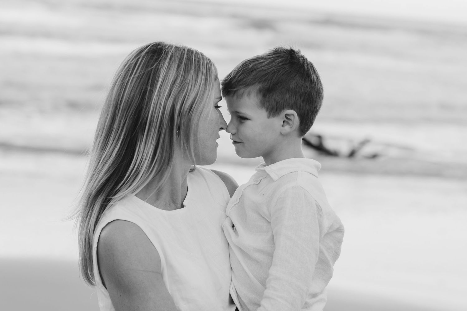 Intimate black and white portrait captured at the beach during sunset.Family photography cabarita New South Wales Cabarita headland