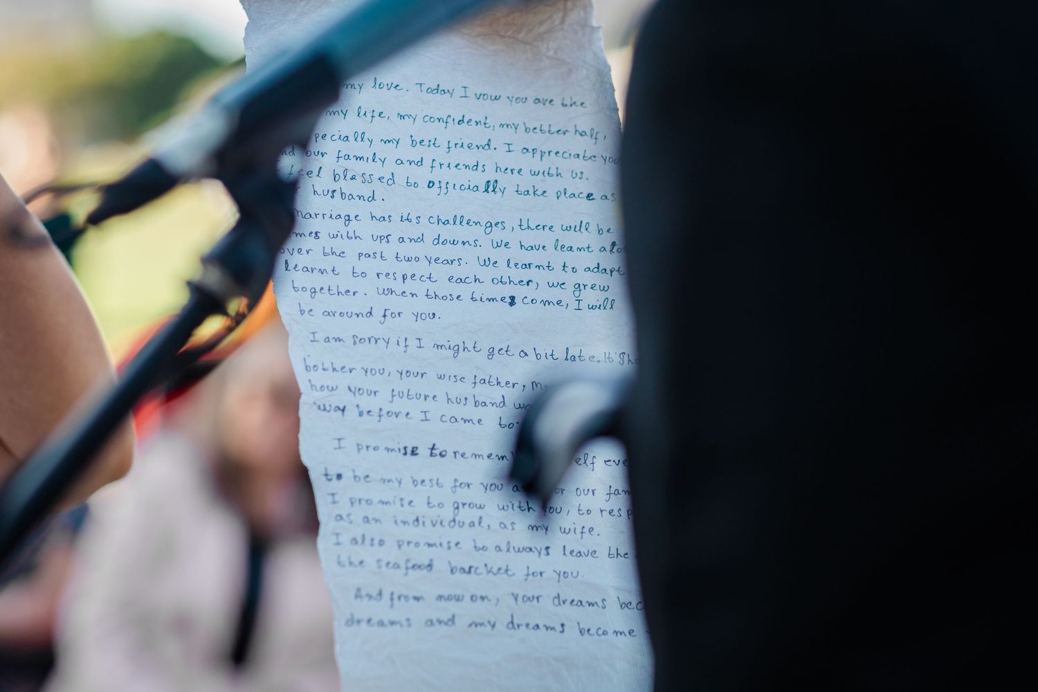 Close-up of handwritten vows being read during a wedding ceremony. Surfers Paradise Golf Club wedding.