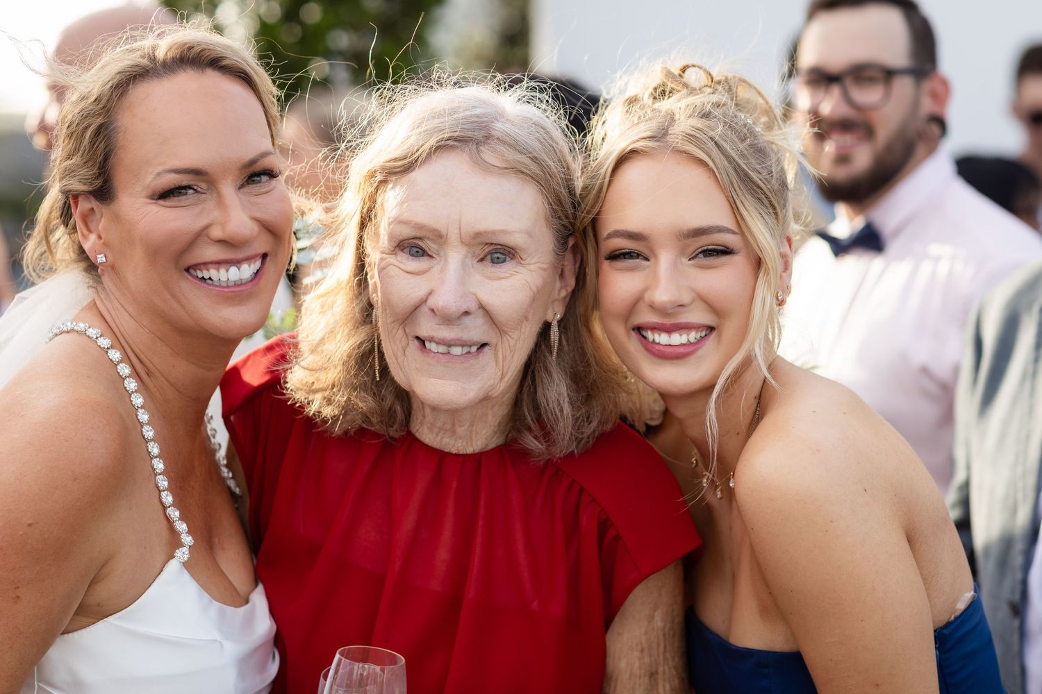 Wedding party members sharing joyful moments during outdoor photo session.Brisbane wedding venue