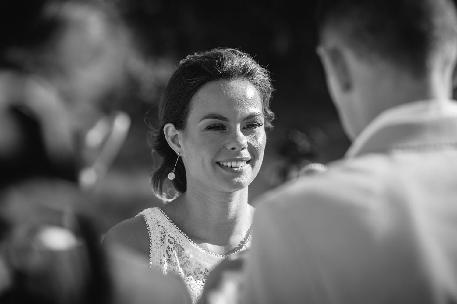 Black and white close-up shots of emotional wedding moments during an outdoor ceremony.