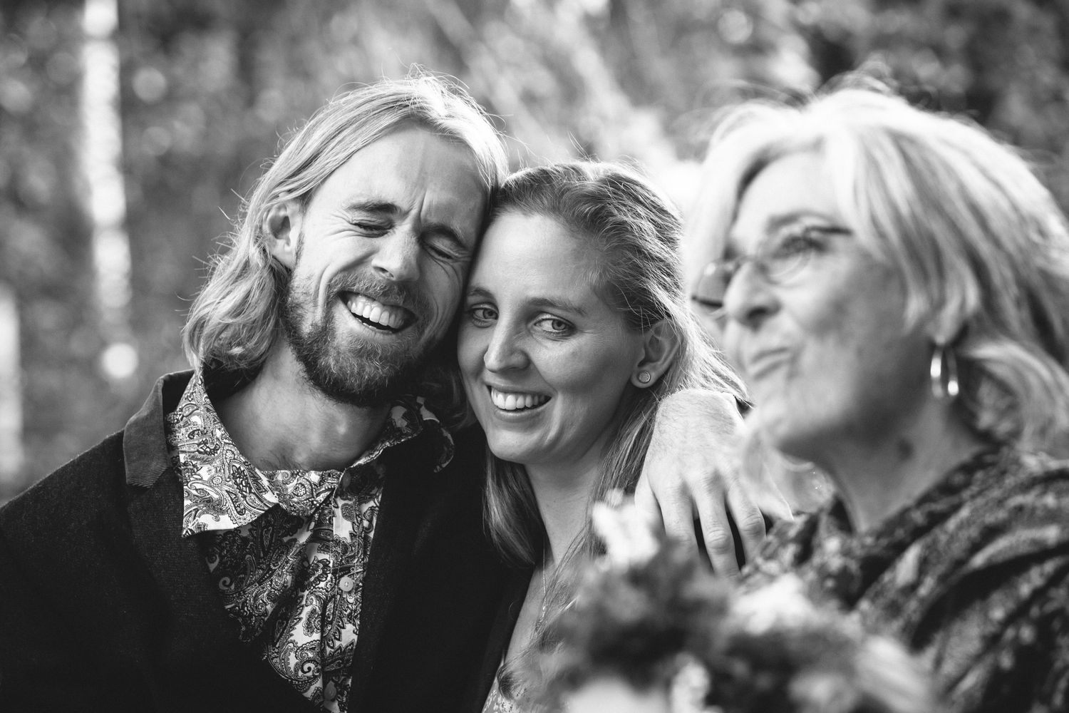 A series of candid black and white portraits showing joyful moments of laughter and connection.DIY wedding Gold Coast elopement photographer