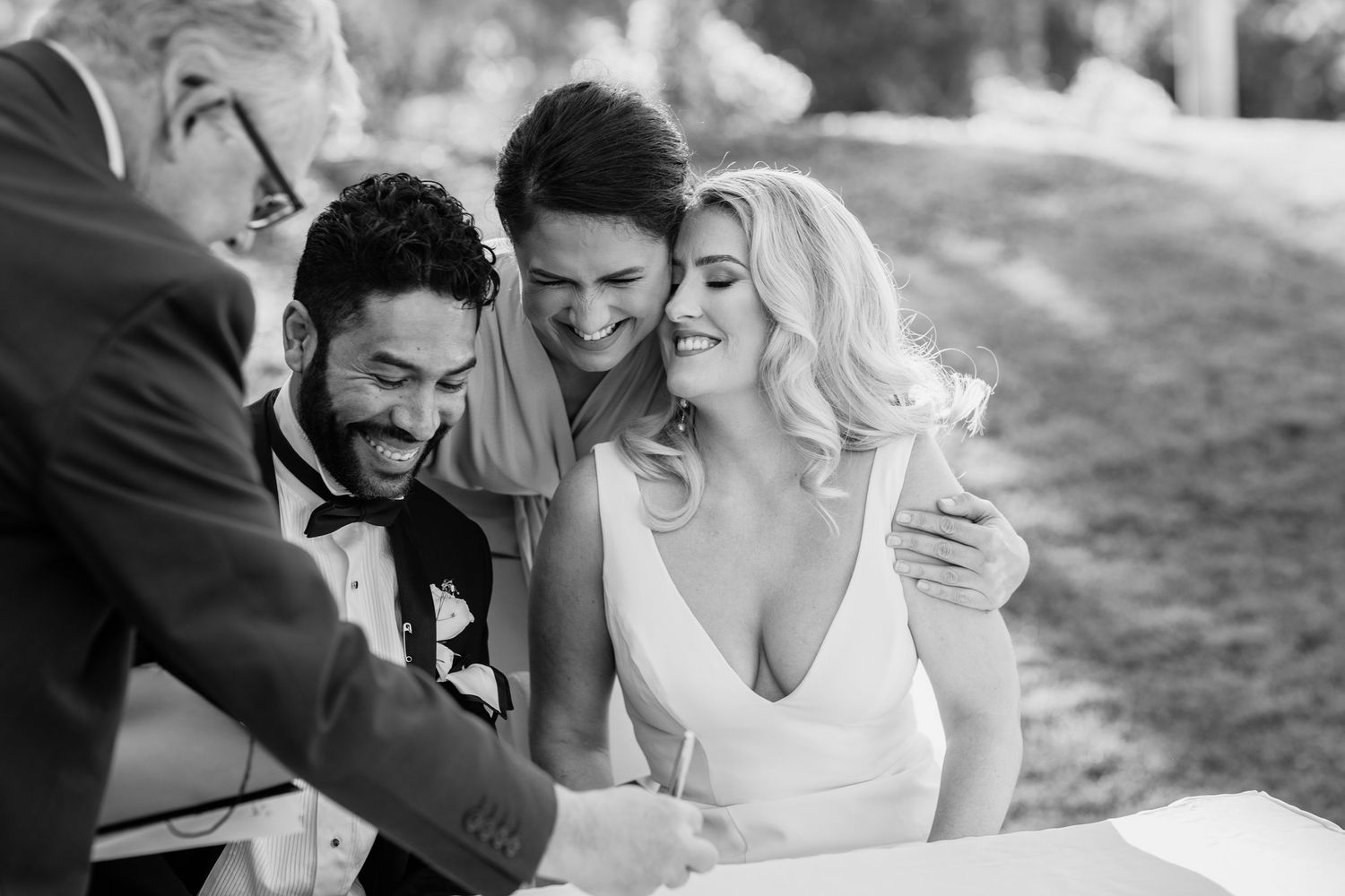 A series of black and white candid wedding photos showing joyful moments between a couple during their celebration. Surfers Paradise Golf Cl