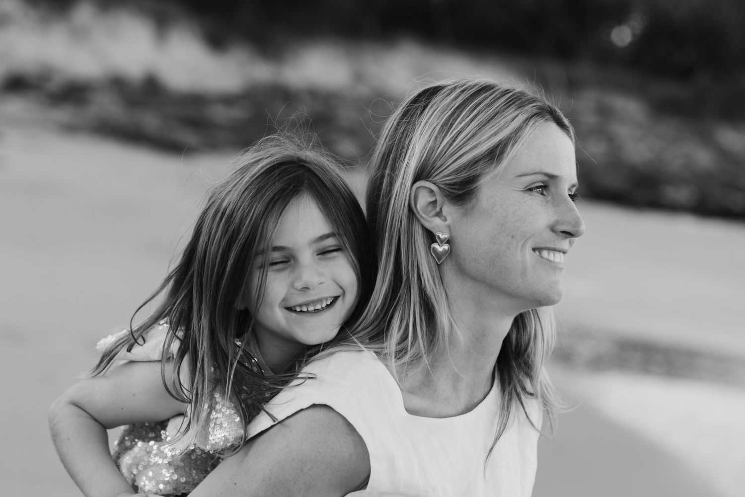 Friends enjoying a casual moment together outdoors in natural lighting. Family photography cabarita New South Wales Cabarita headland