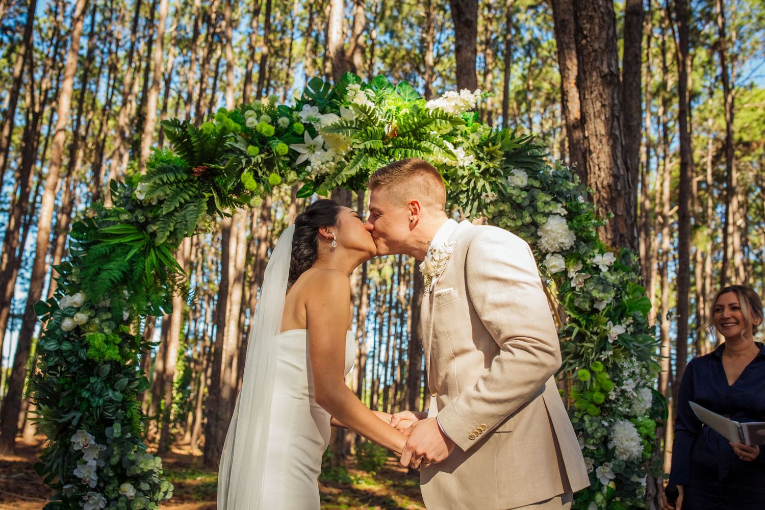 Couple shares romantic moments among tall pine trees during sunset.pizzey park wedding Gold Coast