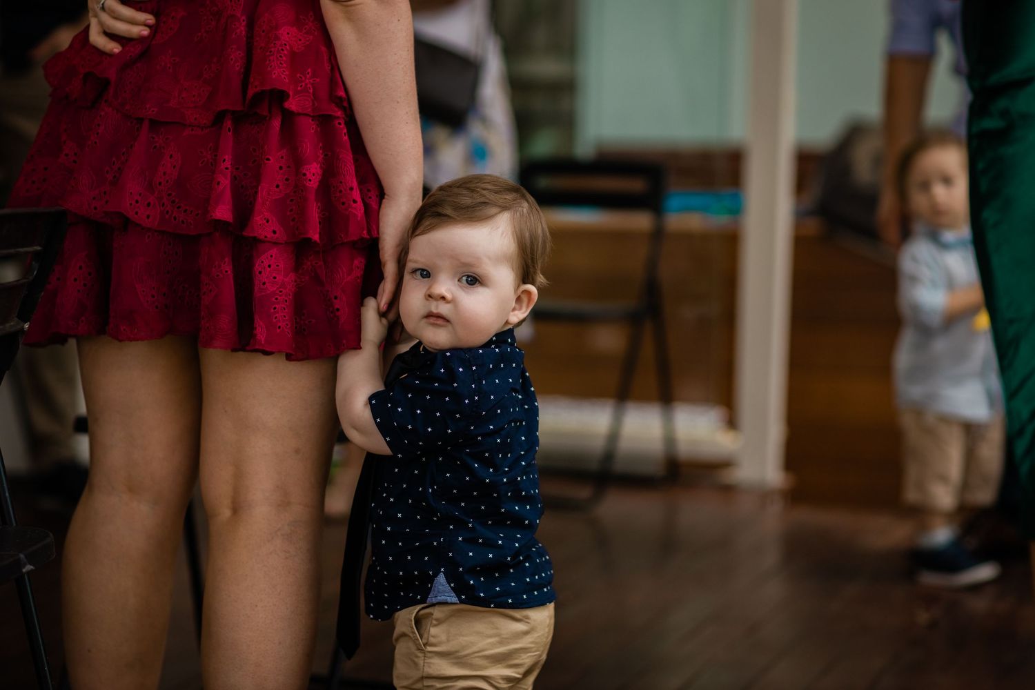 Candid moments captured during a wedding reception indoors.